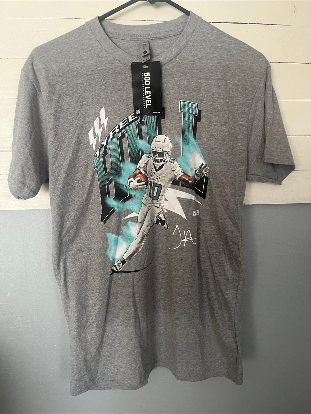 Next Level Apparel Gray Football Graphic Tee with Teal Accents